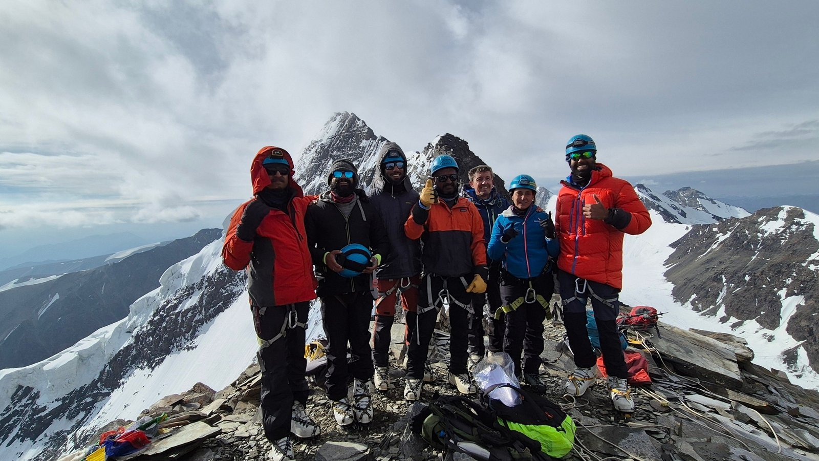 Climbing team together on a snowy Kang Yatse II ridge